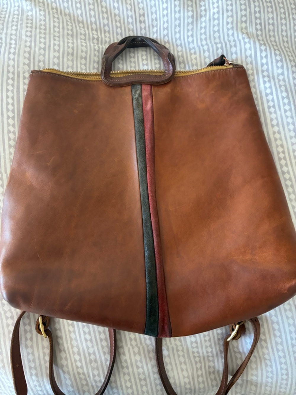 Clare V. well loved leather backpack.